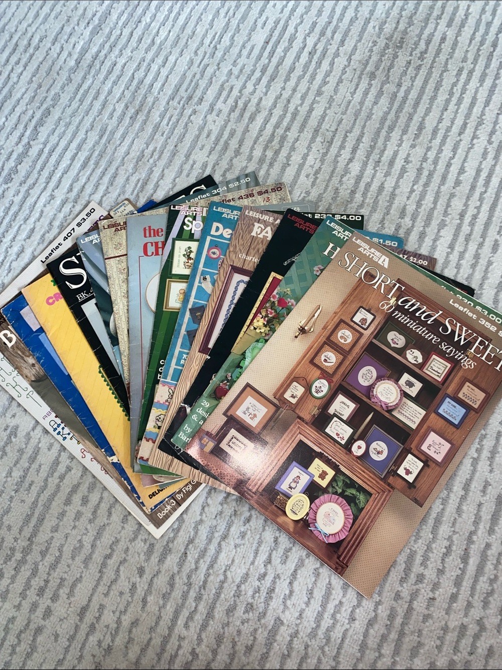 15 Different Leisure Arts Cross Stitch Pattern Books. Varied Subjects
